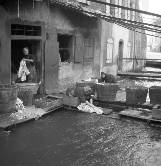 Framed Print : Housewives do their laundry on the banks of a river