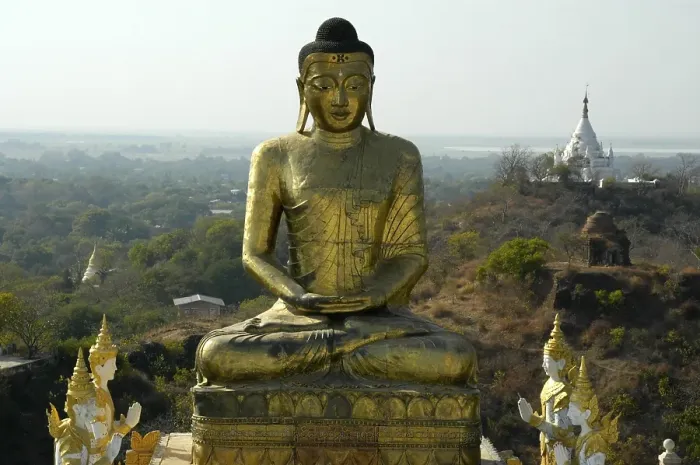 Framed Print : Huge meditating Buddha figure in gold Framed Print : Huge meditating Buddha figure in gold