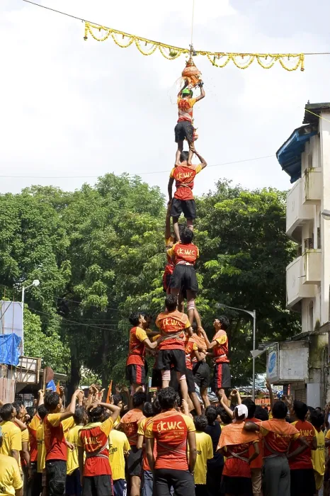 Framed Print : Human pyramid broken dahi handi shower of curd and turmeric water on janmashtami festival at dadar Framed Print : Human pyramid broken dahi handi shower of curd and turmeric water on janmashtami festival at dadar