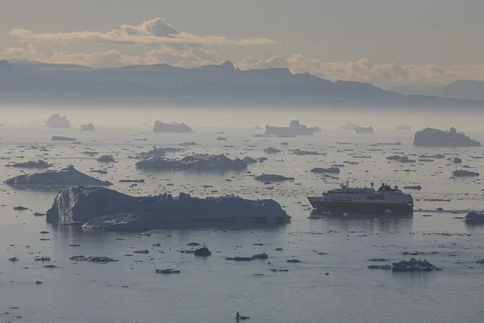 Framed Print : Hurtigruten ship sails through icebergs and ice floes