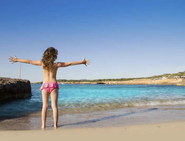 Framed Print : Ibiza Cala Conta beach open arms little girl happy in summer vacation