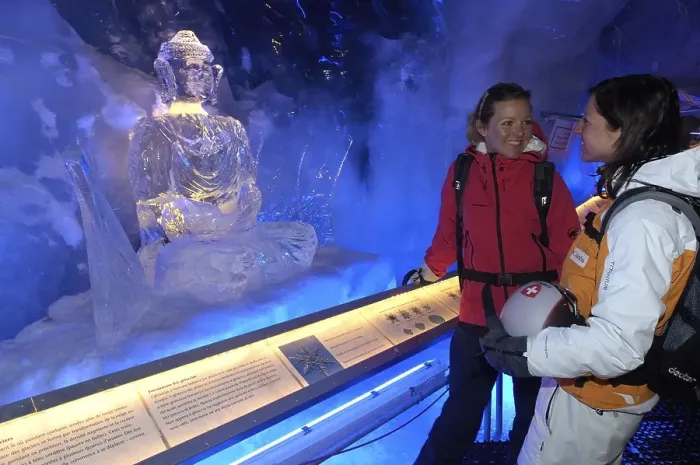 Framed Print : Ice Buddha statue admired by tourists in the ice cave in the Gletscherpalast or Glacier Palace