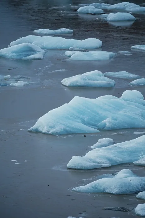 Framed Print : Ice pieces floating in still water with a blue tint Framed Print : Ice pieces floating in still water with a blue tint