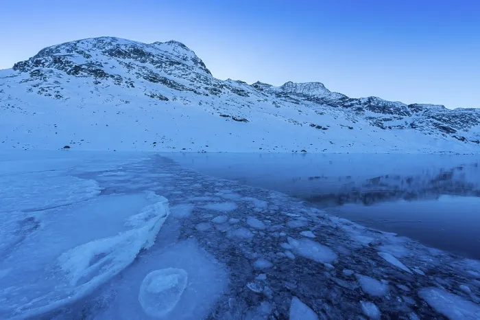 Framed Print : Ice structures in the black ice of the frozen Lago Bianco in the Swiss mountains