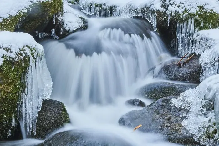 Framed Print : Icicles on wild river in nature reserve Hoelle