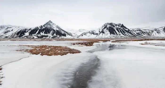 Framed Print : Icy landscape, volcanic black mountains with snow