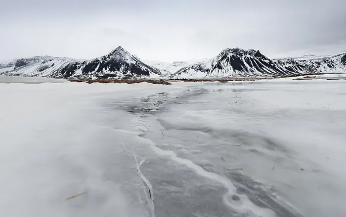 Framed Print : Icy landscape, volcanic black mountains with snow