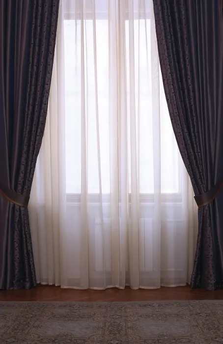 Framed Print : Two identical portieres between which window