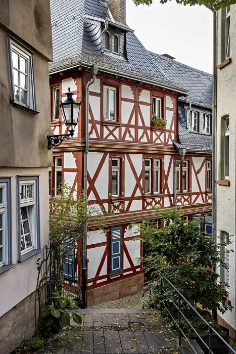 Framed Print : Idyllic half-timbered houses in a narrow alley with a nostalgic atmosphere