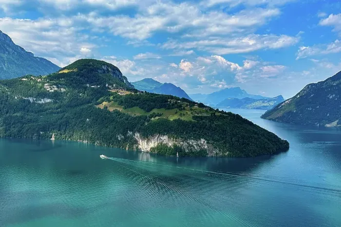 Framed Print : An idyllic lake with blue water, surrounded by mountains under a cloudy sky, crossed by a boat, Morschach, Switzerland, Europe Framed Print : An idyllic lake with blue water, surrounded by mountains under a cloudy sky, crossed by a boat, Morschach, Switzerland, Europe