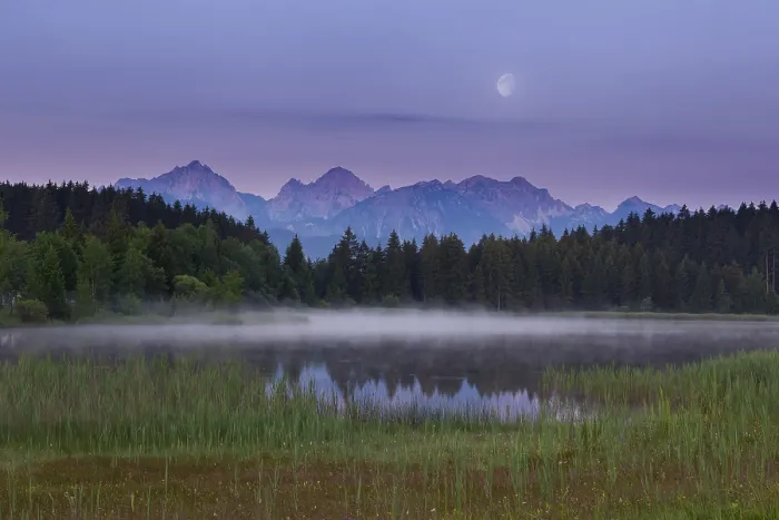Framed Print : Idyllic lake at dusk with mountains and forests in the background Framed Print : Idyllic lake at dusk with mountains and forests in the background