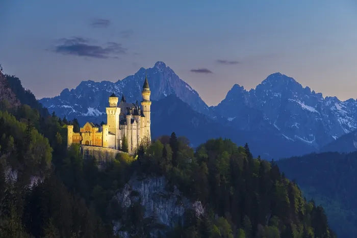 Framed Print : Illuminated castle against a mountain backdrop at night Framed Print : Illuminated castle against a mountain backdrop at night