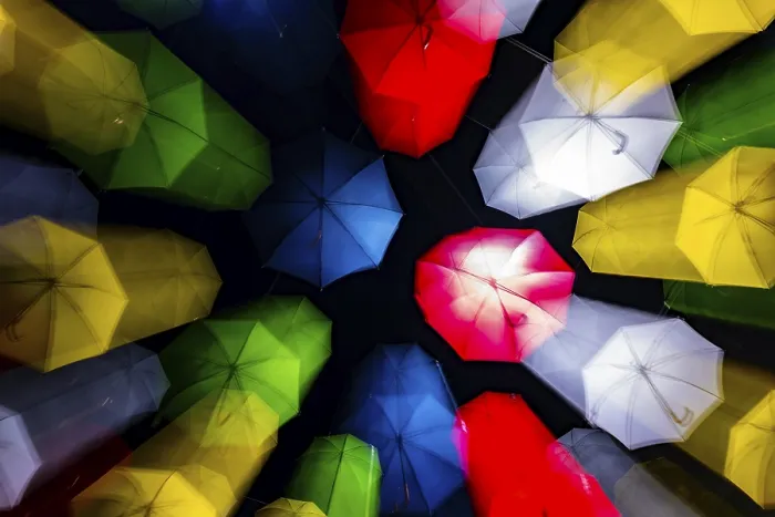 Framed Print : Many Illuminated Colorful Umbrella in Blurred Motion Hanging Against Sky at Night in Switzerland