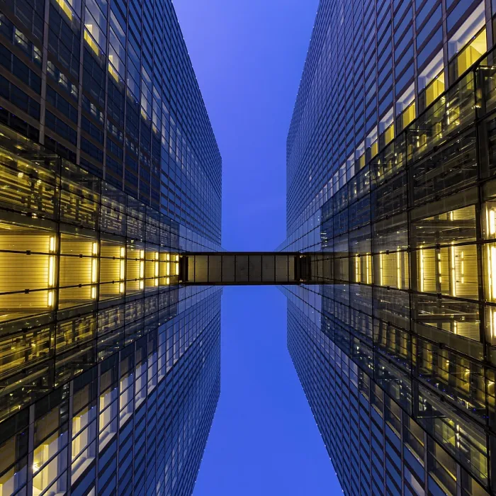 Framed Print : Two illuminated towers with symmetrical design at dusk Framed Print : Two illuminated towers with symmetrical design at dusk