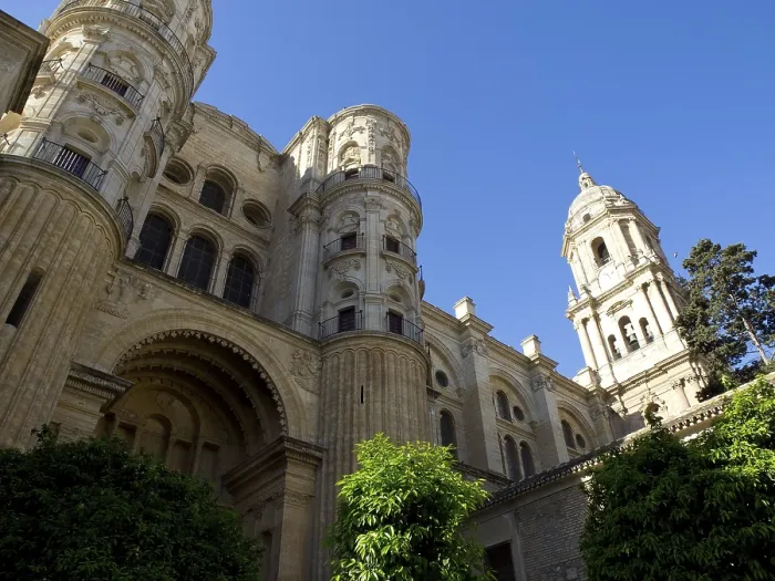 Framed Print : Imposing cathedral with two towers and richly decorated facades against a blue sky