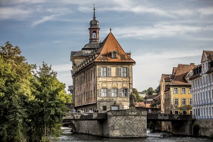 Framed Print : Imposing half-timbered house on a bridge with clear colours Framed Print : Imposing half-timbered house on a bridge with clear colours