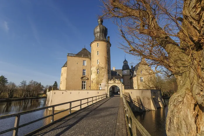 Framed Print : Impressive castle with bridge and tower in sunny surroundings Framed Print : Impressive castle with bridge and tower in sunny surroundings