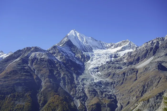 Framed Print : Impressive mountain peak with glacier under bright blue sky
