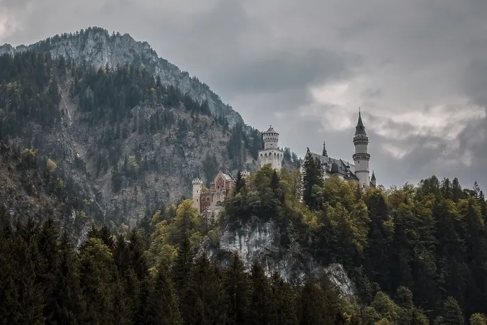 Framed Print : The impressive Neuschwanstein Castle on a dense