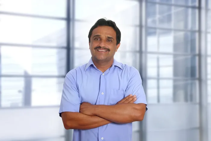 Framed Print : Indian latin businessman blue shirt in modern office background