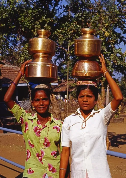 Framed Print : Two Indian women with brass vessels on their heads, Elephanta Island, Mumbai, India, Asia