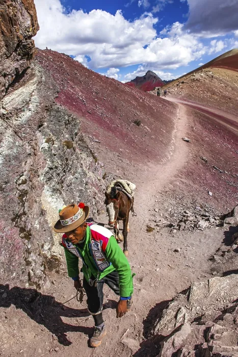Framed Print : Indigenous guide with packhorse in the rainbow mountains