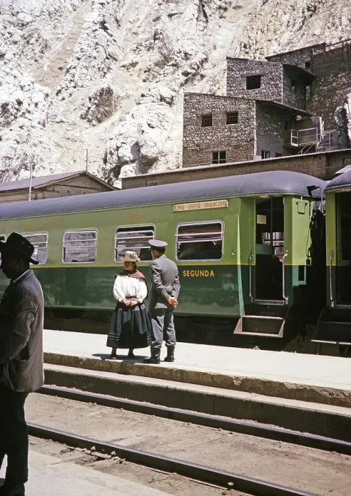 Framed Print : Indigenous woman and railway official standing on the platform at the train, La Oroya railway station, Peru, South America around 1962, South America
