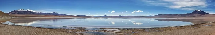 Framed Print : Infinite horizon with a reflecting lake and majestic mountains under a blue sky