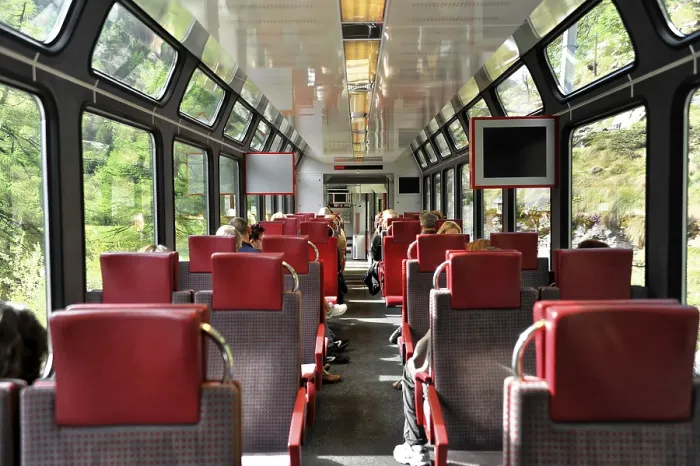 Framed Print : Interior of a train with red seats and large windows