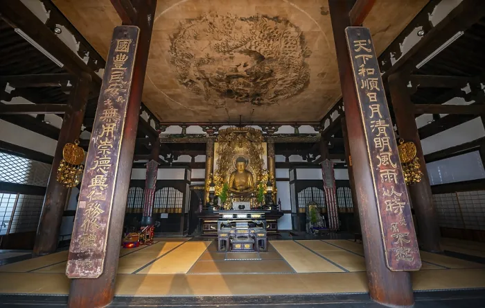 Framed Print : Interior view, golden Buddha figure and ceiling painting with dragon figure