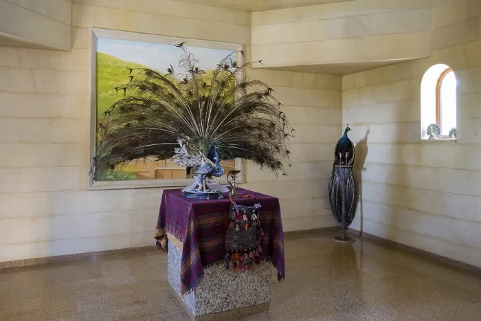 Framed Print : Interior view with peacock sculpture and colourful cloth on table Framed Print : Interior view with peacock sculpture and colourful cloth on table