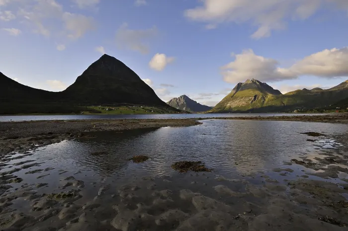 Framed Print : The island of Aldra with the Hjartinden peaks from the shore at Haugland