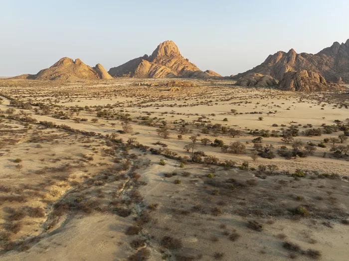 Framed Print : The isolated Spitzkoppe mountain (1728 m) majestically rises above the surrounding desert plains