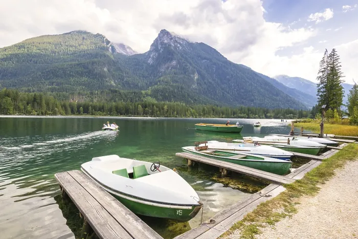 Framed Print : Jetty with boats at Hintersee, with green mountains in the background