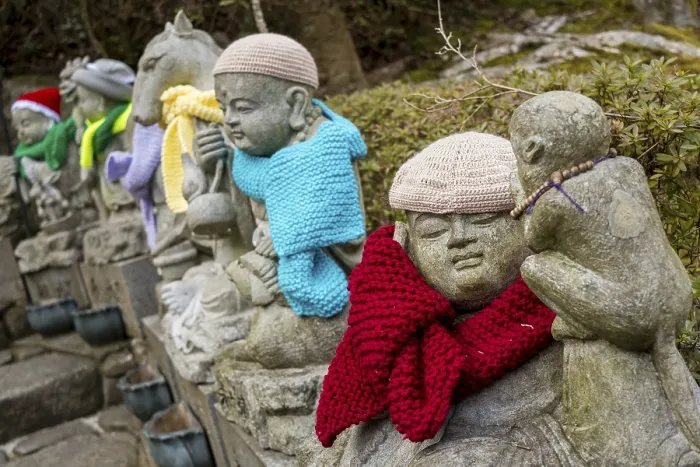 Framed Print : Jizo statues with colourful hats and scarves in Japan