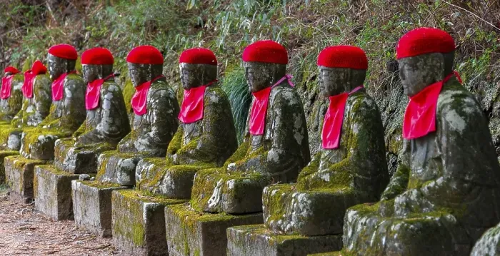 Framed Print : Jizo statues with red caps, protective deities for deceased children