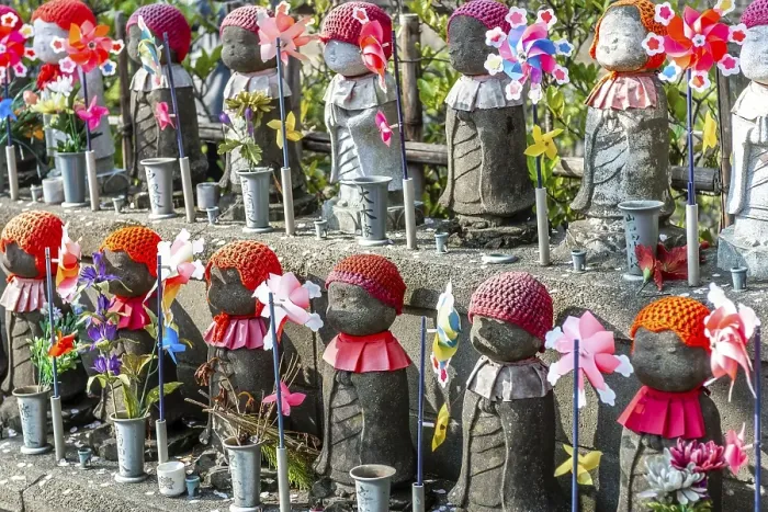 Framed Print : Jizo statues with red caps, protective deities for deceased children
