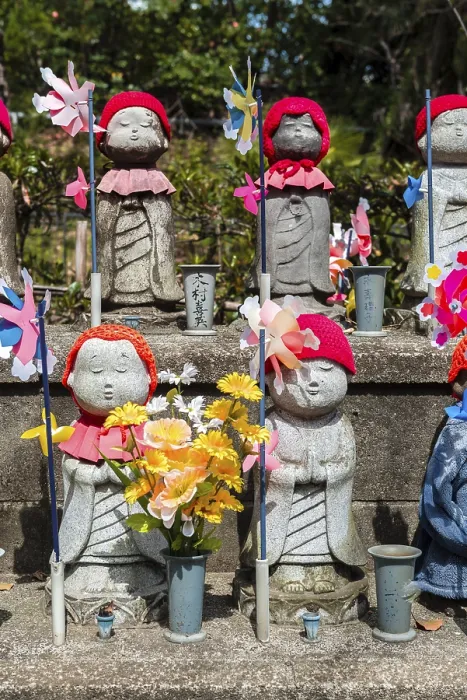 Framed Print : Jizo statues with red caps, protective deities for deceased children