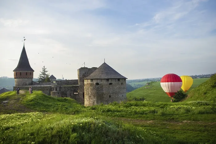 Framed Print : Kamianets-Podilskyi, Ukraine. Colorful balloons flying over a beautiful medieval castle
