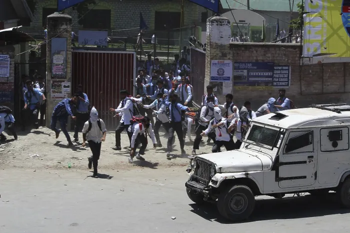Framed Print : Kashmiri students protest by stone pelting at police jeep