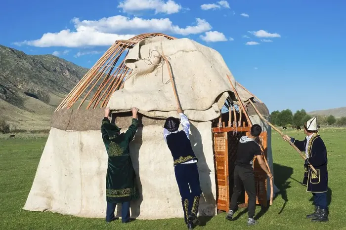 Framed Print : Kazakh men building a yurt, For editorial use only