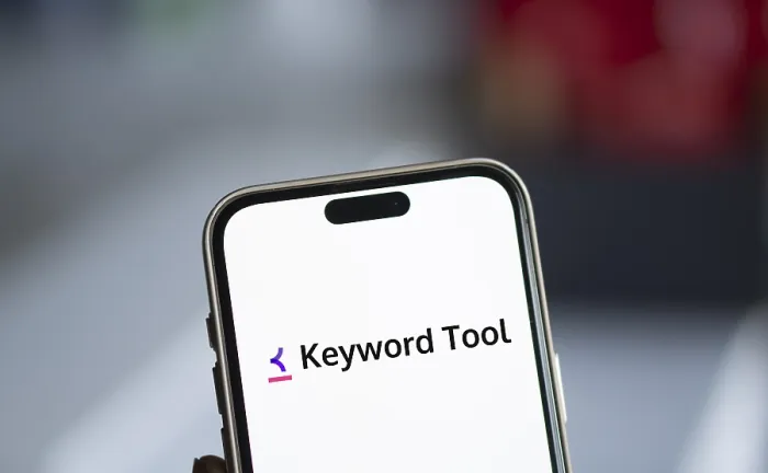 Framed Print : keyword tool logo is displayed on smartphone