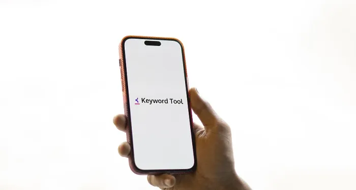 Framed Print : keyword tool logo is displayed on smartphone