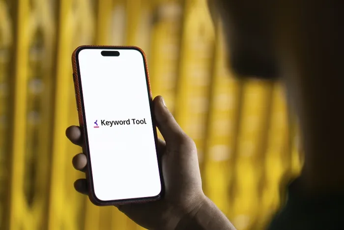 Framed Print : keyword tool logo is displayed on smartphone