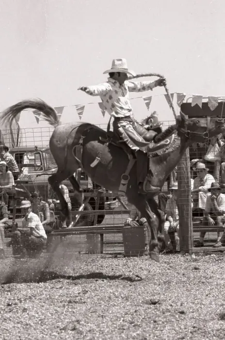 Framed Print : KINGAROY, AUSTRALIA, CIRCA 1980: Unidentified contestant rides a bucking bronco during a small town rodeo