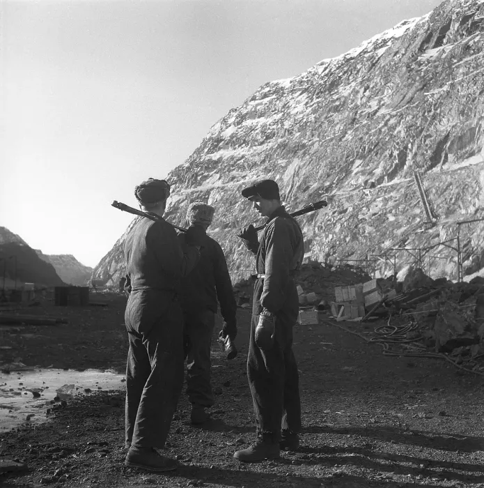 Framed Print : Kiruna Sweden in the 1950s. The open mine and a miners with tools on their shoulders