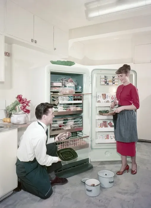 Framed Print : Kitchen from the 1950s. The young Swedish couple in the period kitchen
