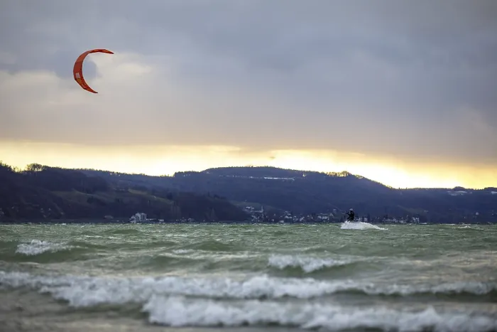 Framed Print : Kitesurfer at sunset, wavy water