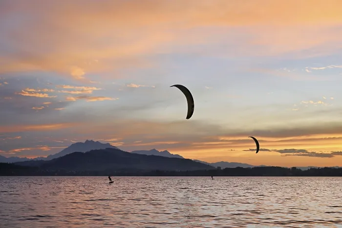Framed Print : Two kitesurfers on Lake Zug at sunset