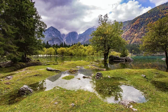 Framed Print : The lake shores are flooded. The mountains are covered with low clouds